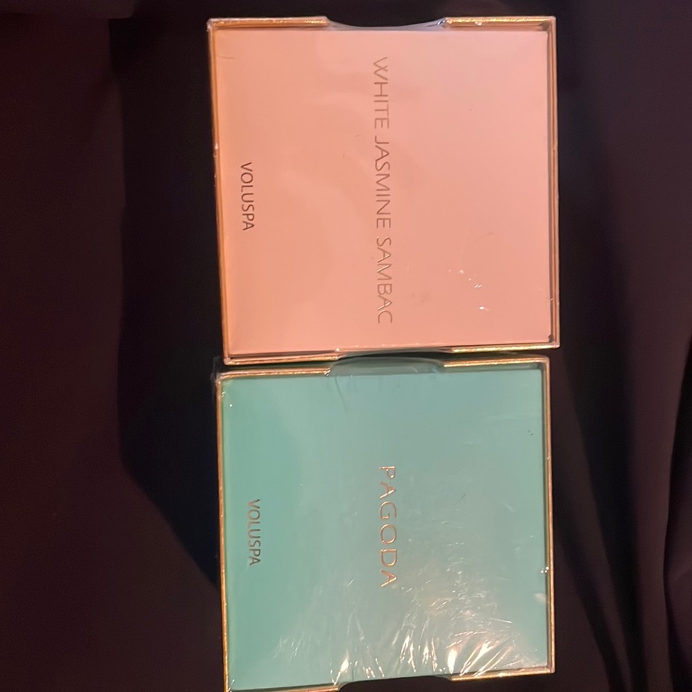 Two 2 oz Voluspa candles new in box.